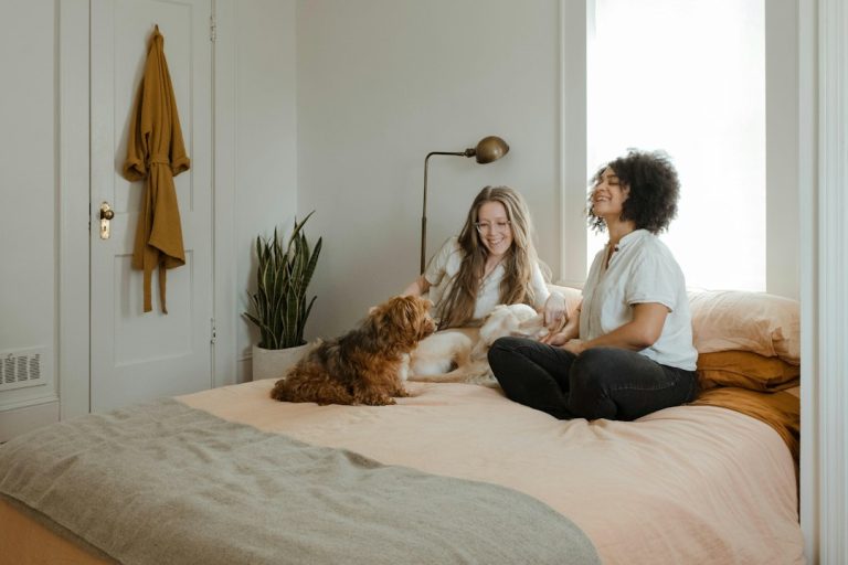 Two caregivers spending time with their dogs at home